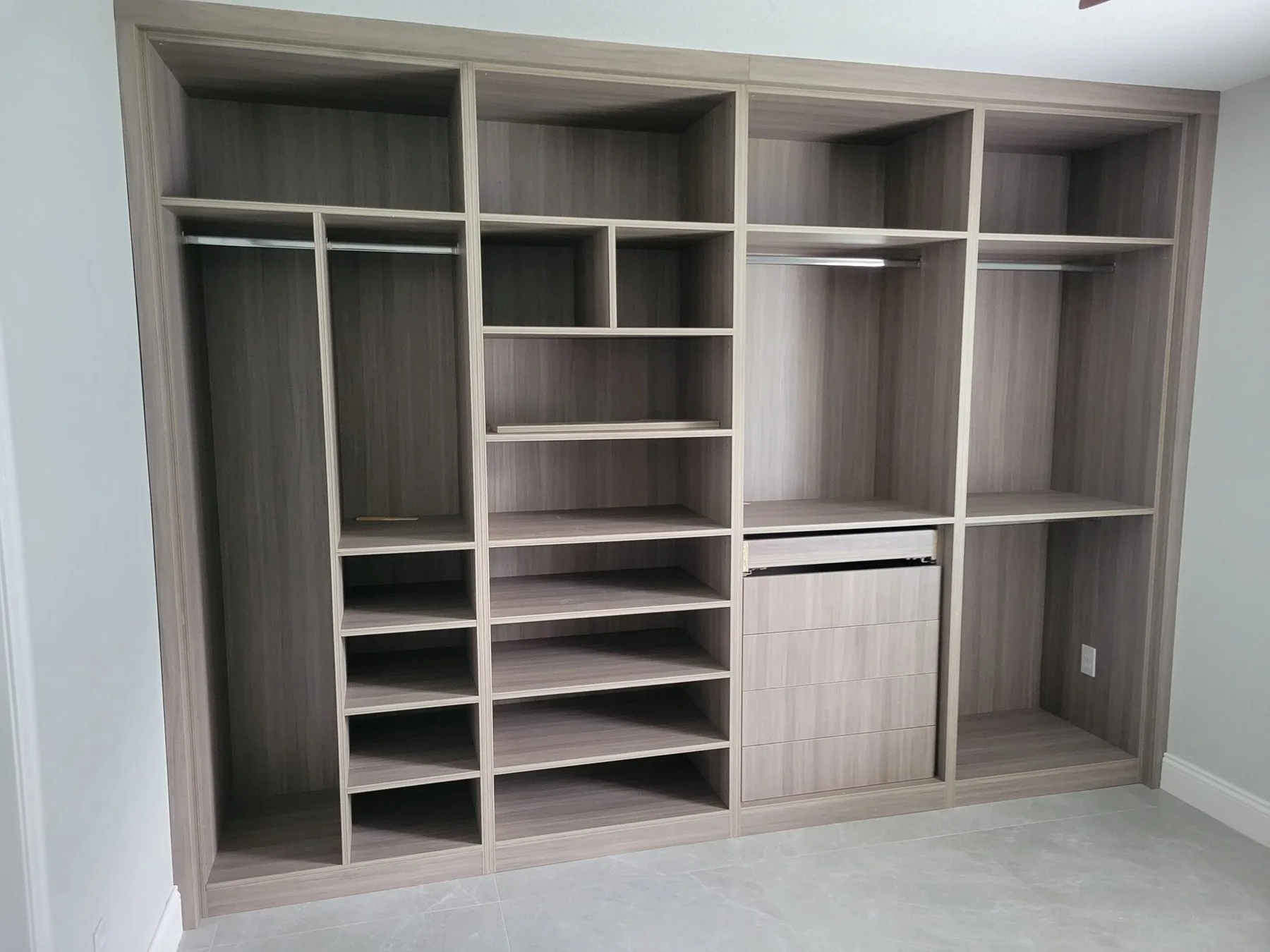 Custom closet built-ins in light wood finish